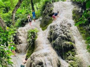 Experience climbing up the unique Bua Tong Waterfall